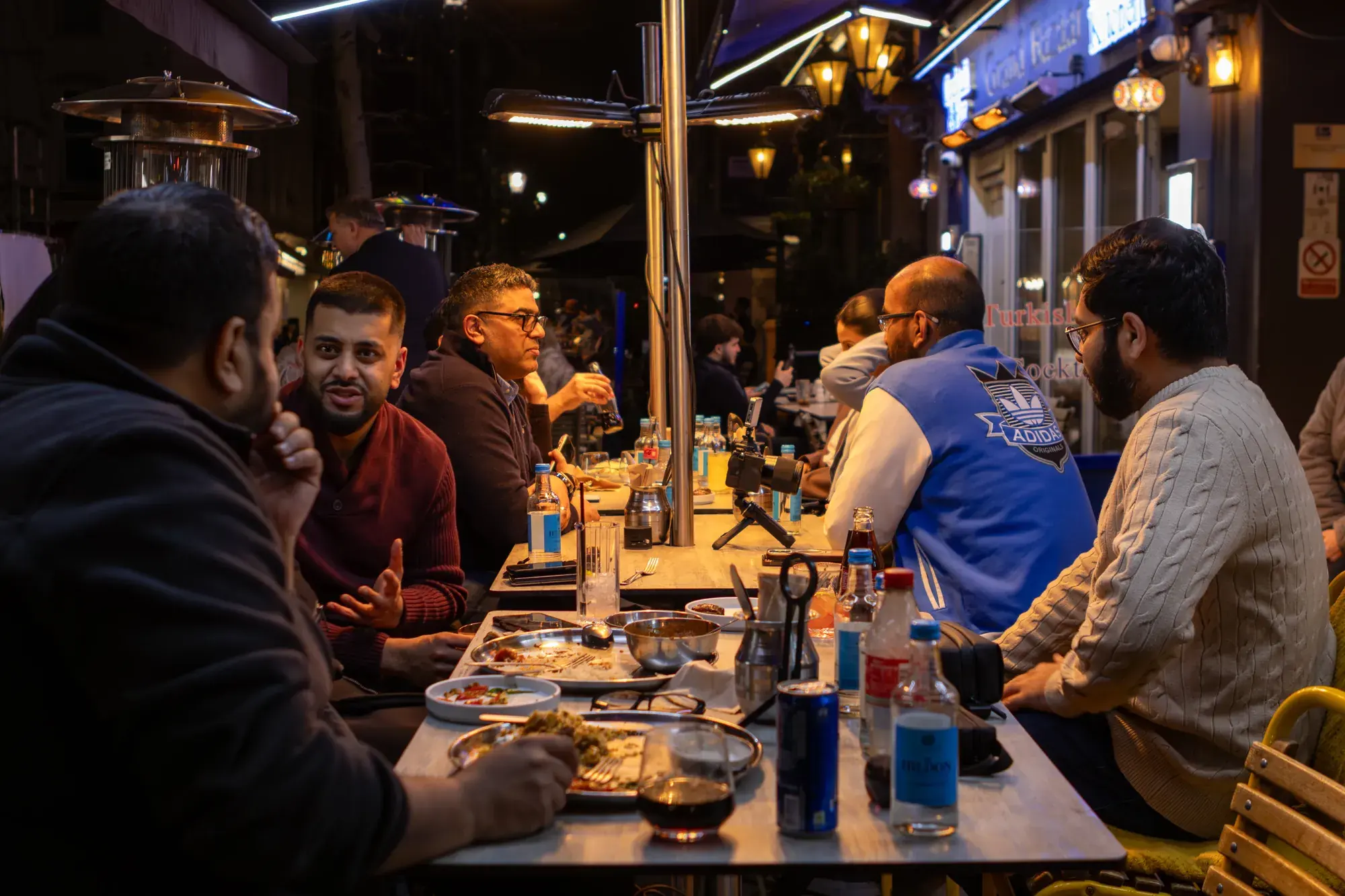 Creators dining together around a long table at a Creators Table event